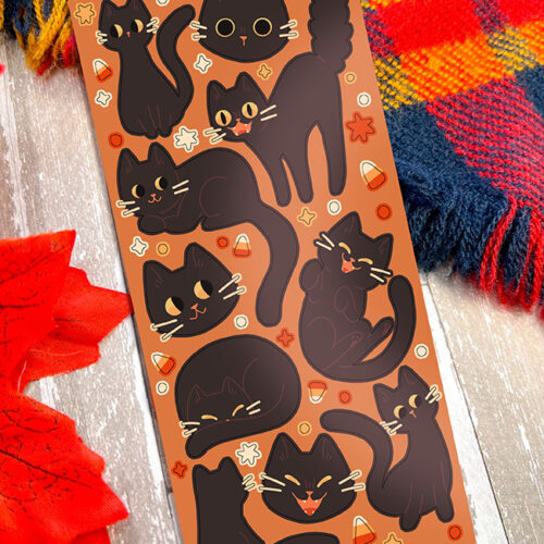 The Silly Spooky Ghosts ~ Deco Sticker Sheet features playful ghost stickers on an orange background with candy corn, stars, and autumn leaves, displayed on rustic wood next to a red leaf and plaid scarf.