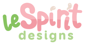 Logo with playful text: leSpirit designs. leSpirit is in pink and green rounded letters, while designs is in green lowercase letters beneath. Two small beige accents appear on the i and t in Spirit.