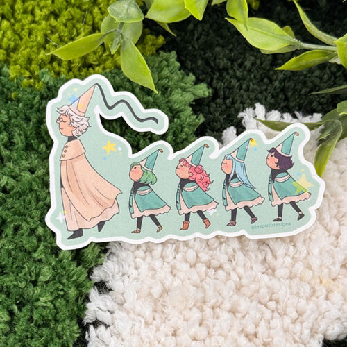 The Uppies Hamster ~ 3" Matte Vinyl Sticker features a white-haired wizard guiding four children in green outfits and hats, all walking in a line amid lush greenery and textured green-and-white fabric.