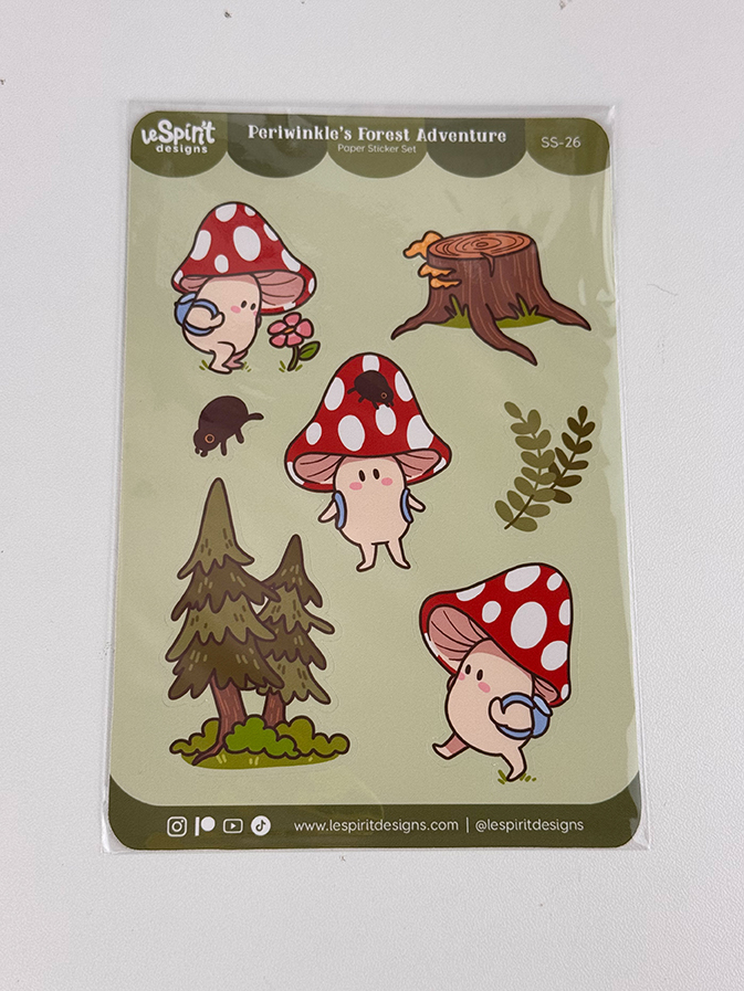 Sticker sheet featuring cute mushroom characters with legs and arms, a tree stump, two trees, a bug, and mushrooms. Text at top reads Periwinkles Forest Adventure Paper Sticker Set..